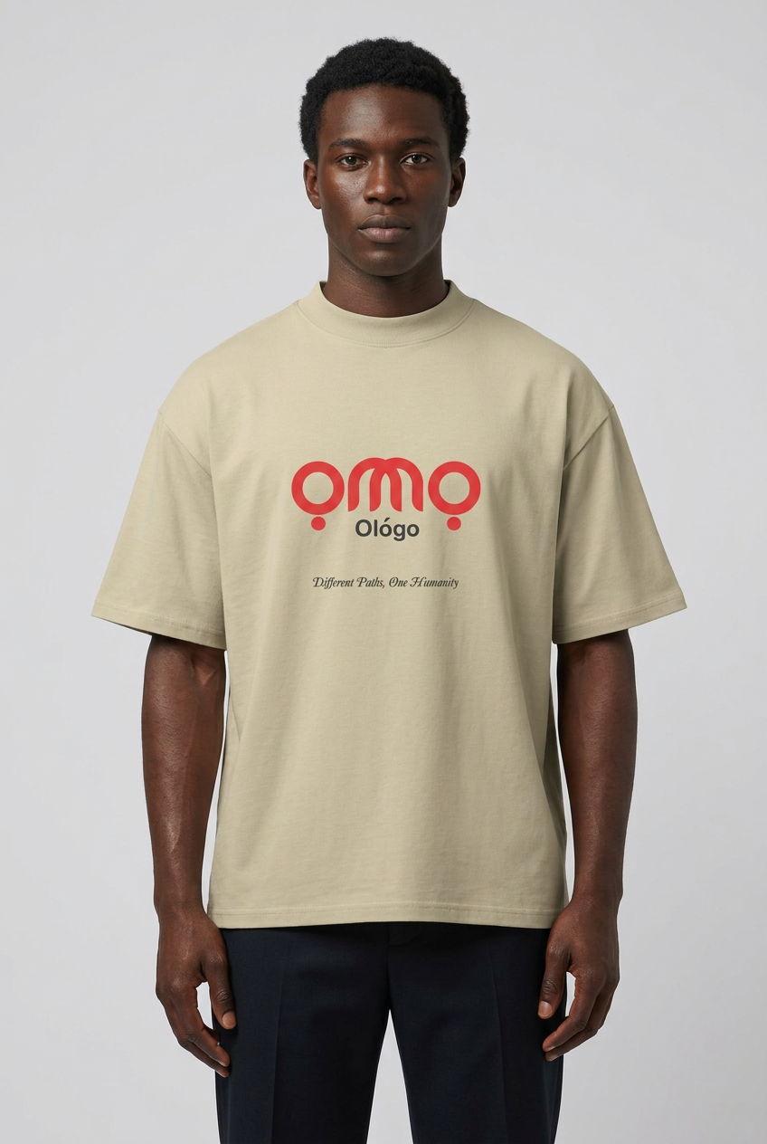 Black male model wearing the Ọmọ Ológo t-shirt