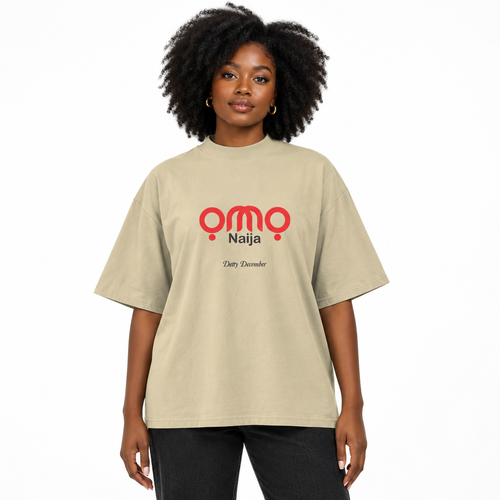 Black female model wearing the stone oversized OMO Naija Detty December T-shirt.