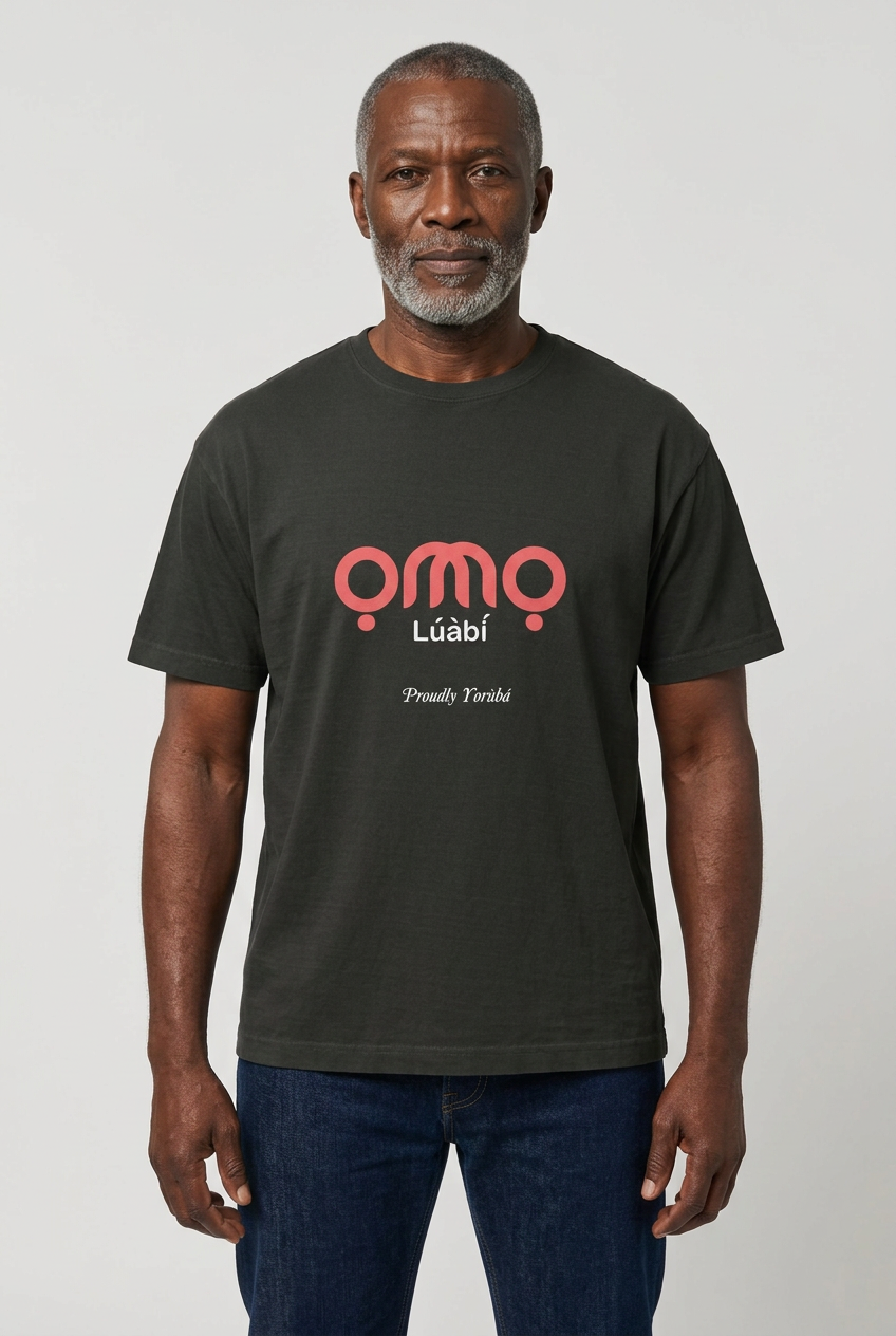 Older Black male model wearing the Omo Lúàbí t-shirt